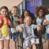 Wheelchair girl smiling with her friends