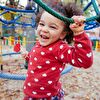 Little girl laughing on playground