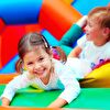 Little girl laughing in bouncy castle