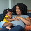 Daughter hug the pregnant mother