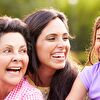Grandmother, mother and daughter laughing