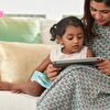 Mother showing something her daughter on tablet