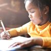 Girl Writing in Sunlight