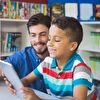 Teacher Assisting Boy With Learning
