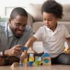 Father and Child Playing With Building Blocks Together